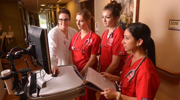 Student interns with nurse instructor